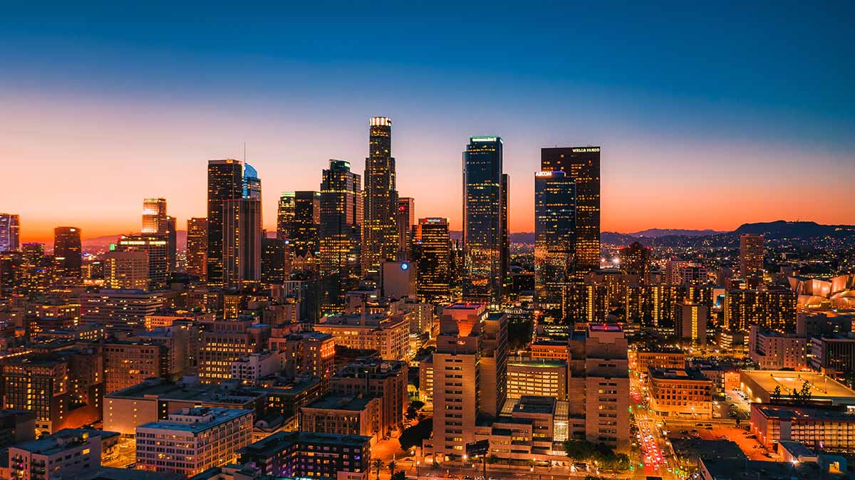 business buildings in Los Angeles, California with a sunset background.