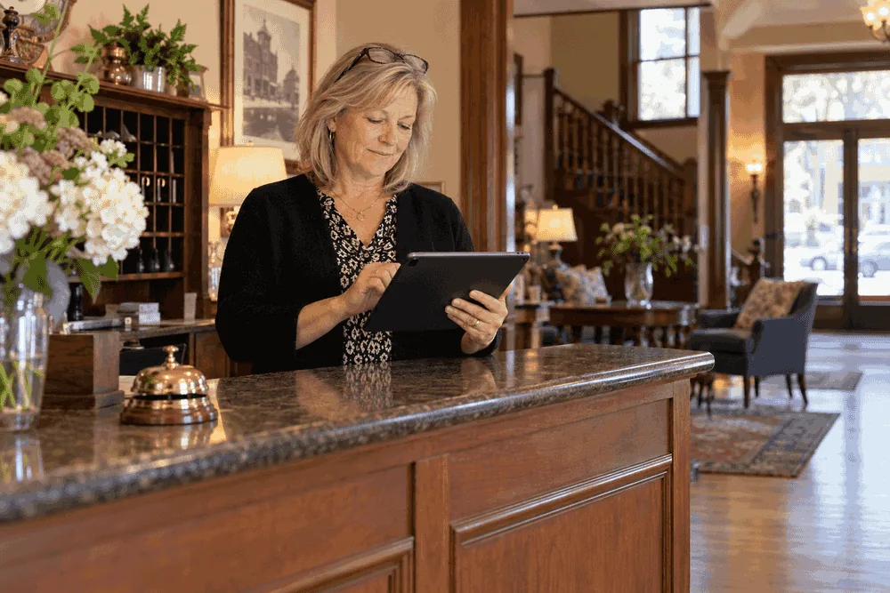 Hotel manager checking Iowa lodging license renewal access.